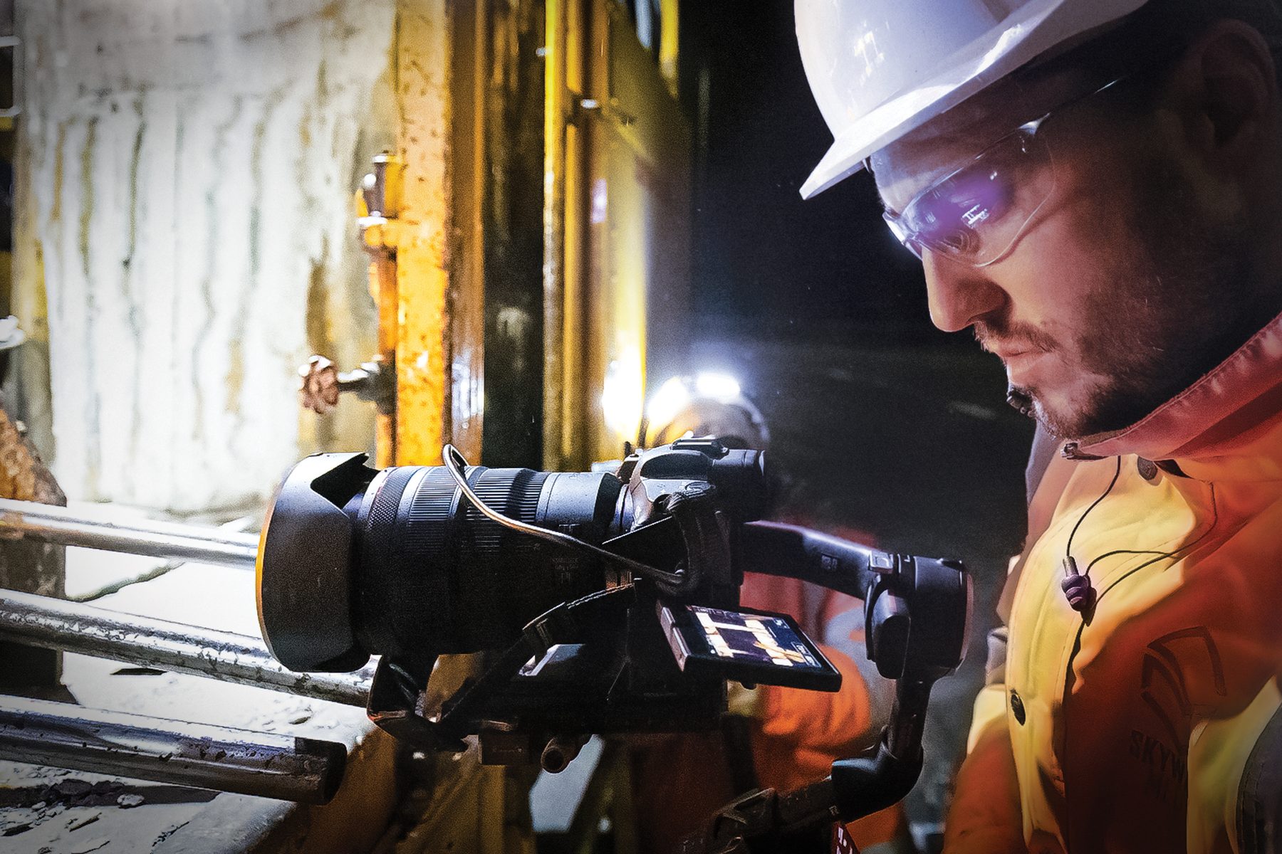 Skyways camera operator filming inside a tunnel under construction